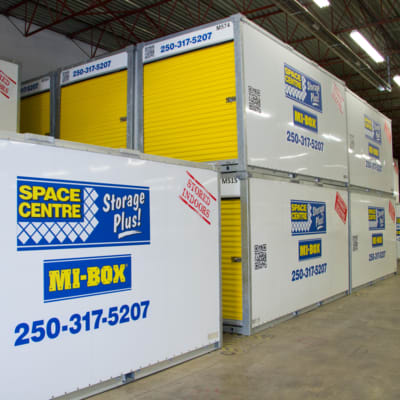 Multiple MI-BOX Storage Containers Stacked in Warehouse