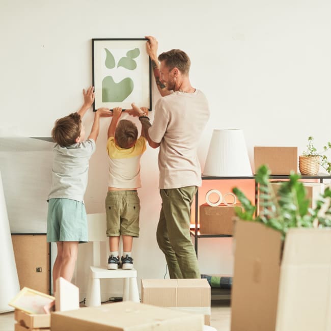 happy family unpacking moving boxes kelowna moving company