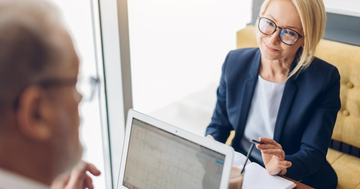 Woman and man meeting with a laptop