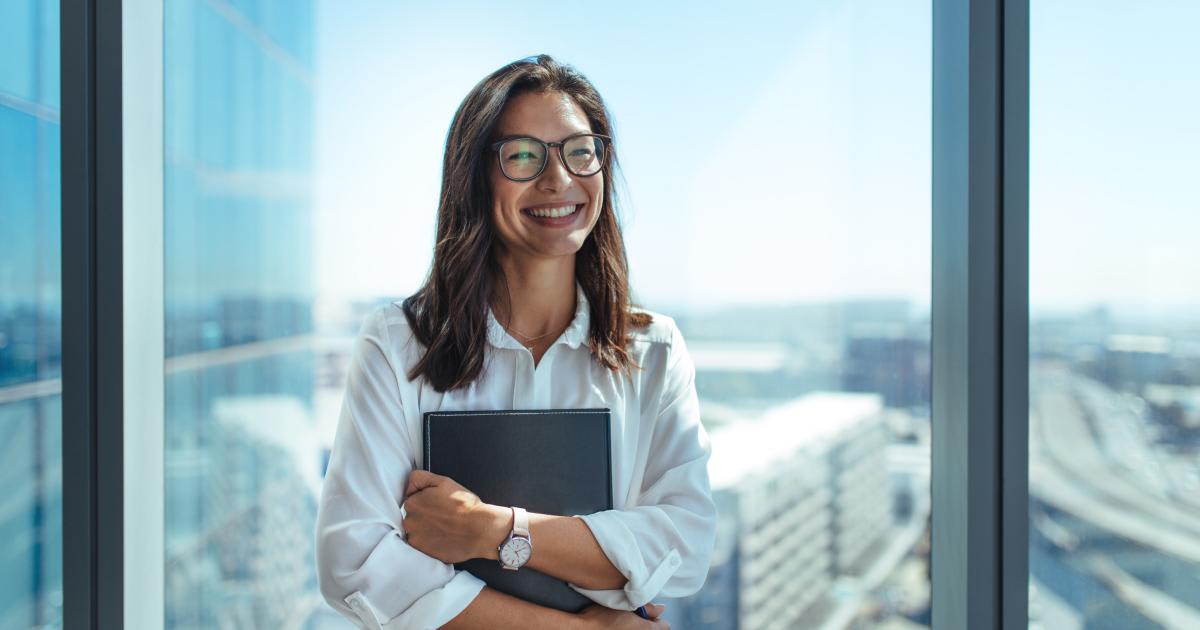 Professional businesswoman representing faith-driven leadership and ethical company evaluation in a modern corporate environment