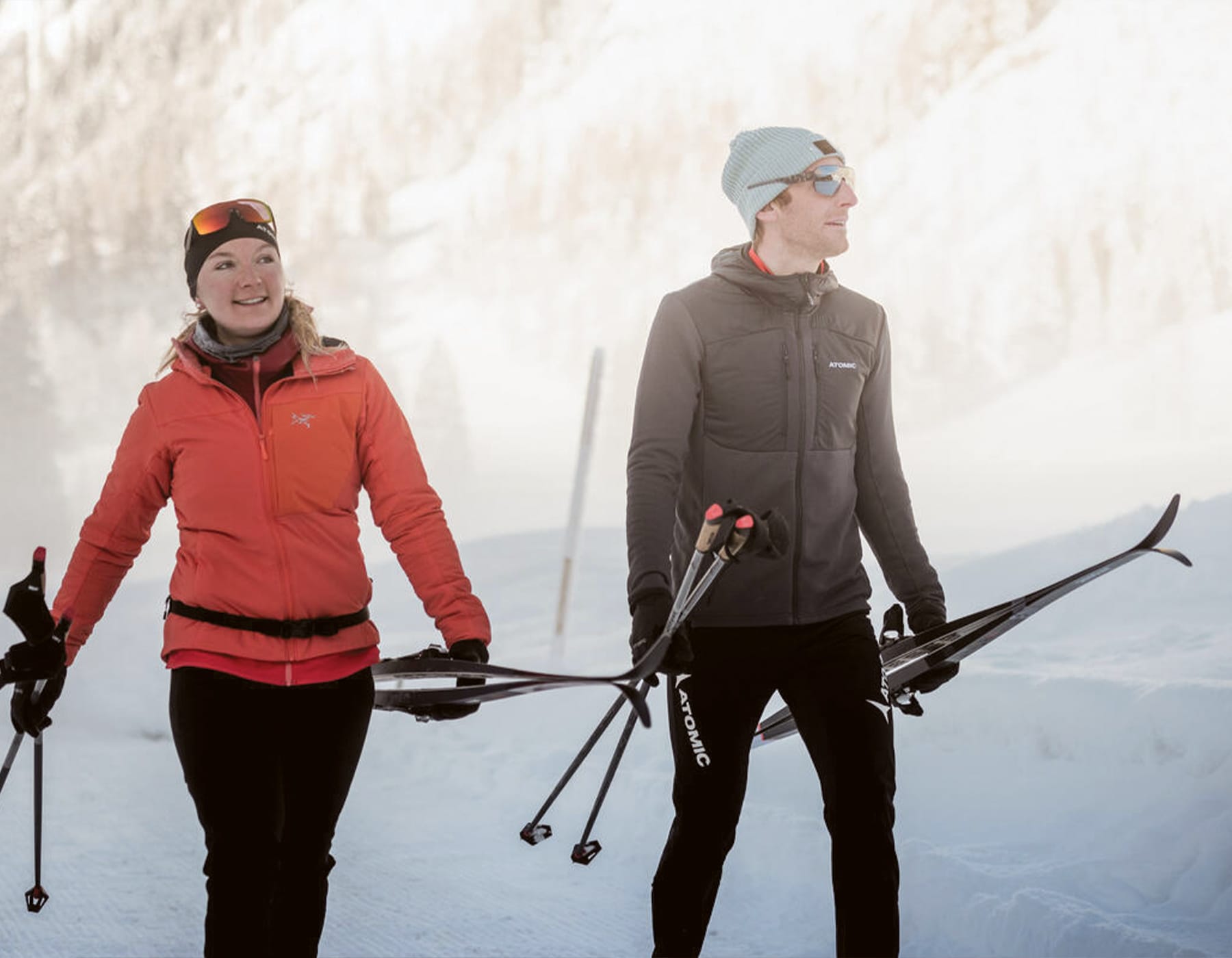 Transparency in Performance. Nordic Skiers carrying Atomic Nordic skis and nordic poles