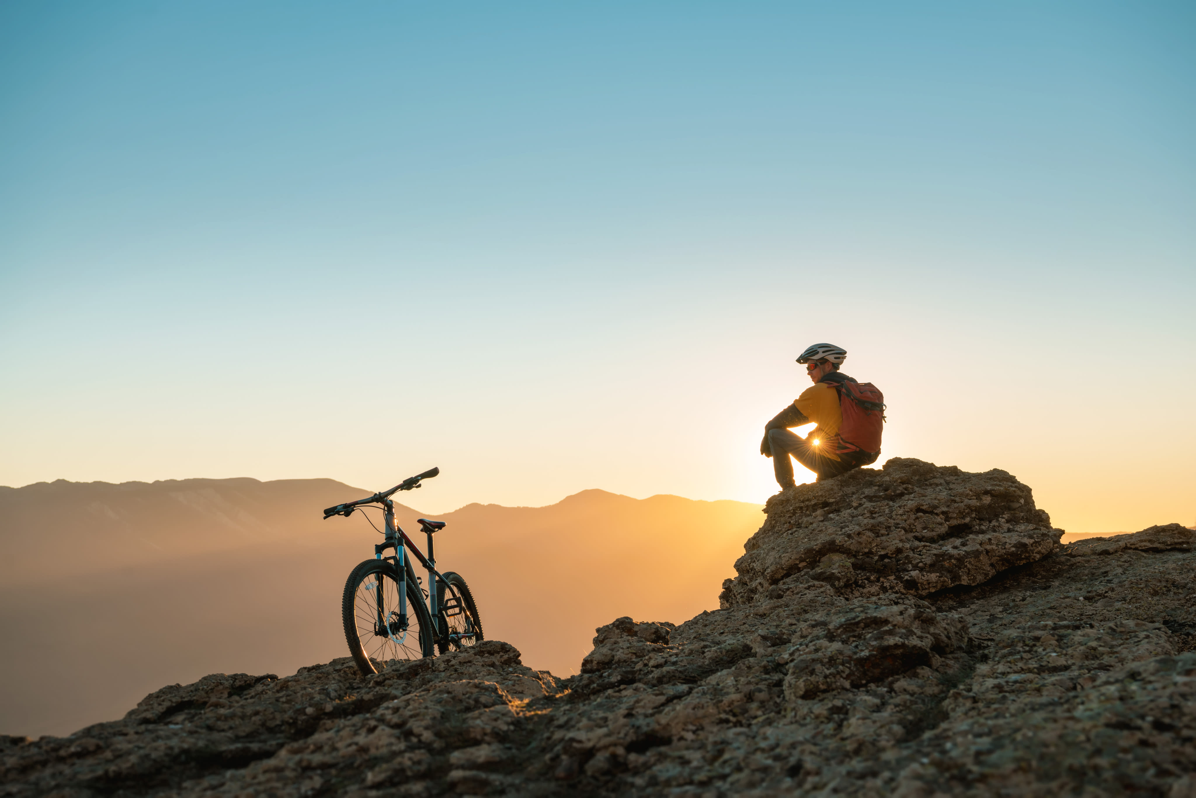 Golden-hour pause on an epic mountain bike adventure in British Columbia. Build confidence, one trail at a time.