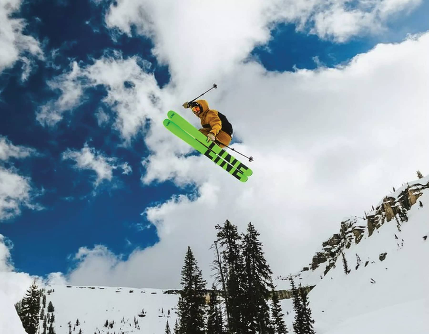 Shop Blizzard Skis Kelowna. Alpine skier carving on Blizzard skis