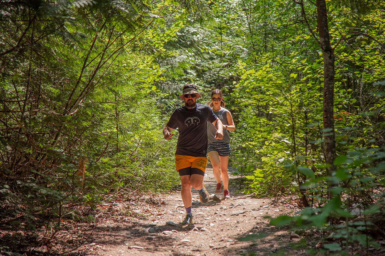 A couple enjoying outdoor running season with their trail running shoes