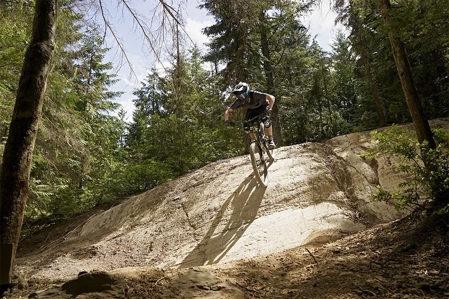 Connor ripping downhill on his mountain bike.