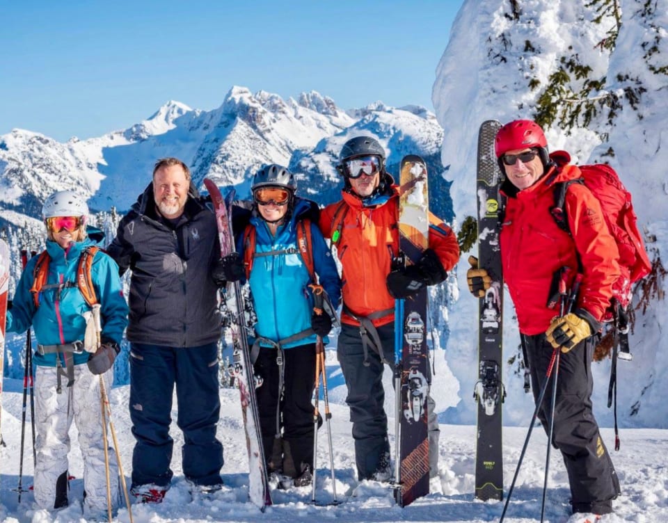 Guests take in the breathtaking views of the surrounding Monashee Mountains while skiing at Keefer Lake Lodge.