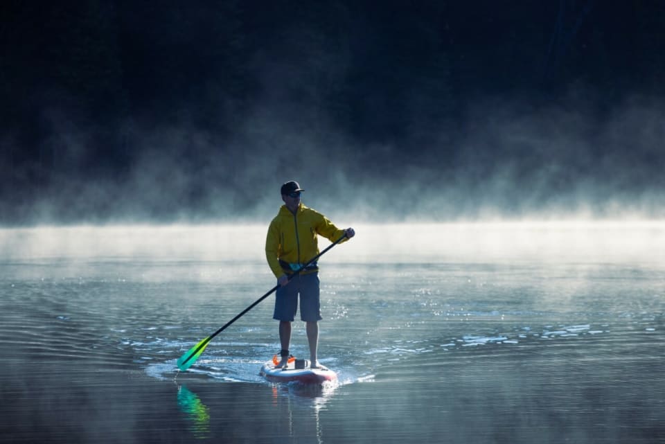 Get active with a paddleboard relay race, a perfect water-based team-building activity.