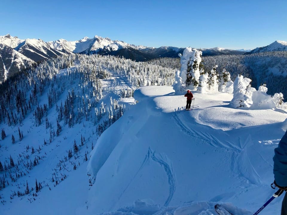 A clear, blue-sky day brings stunning vistas, perfect for skiing and exploring the lodge’s beautiful terrain.