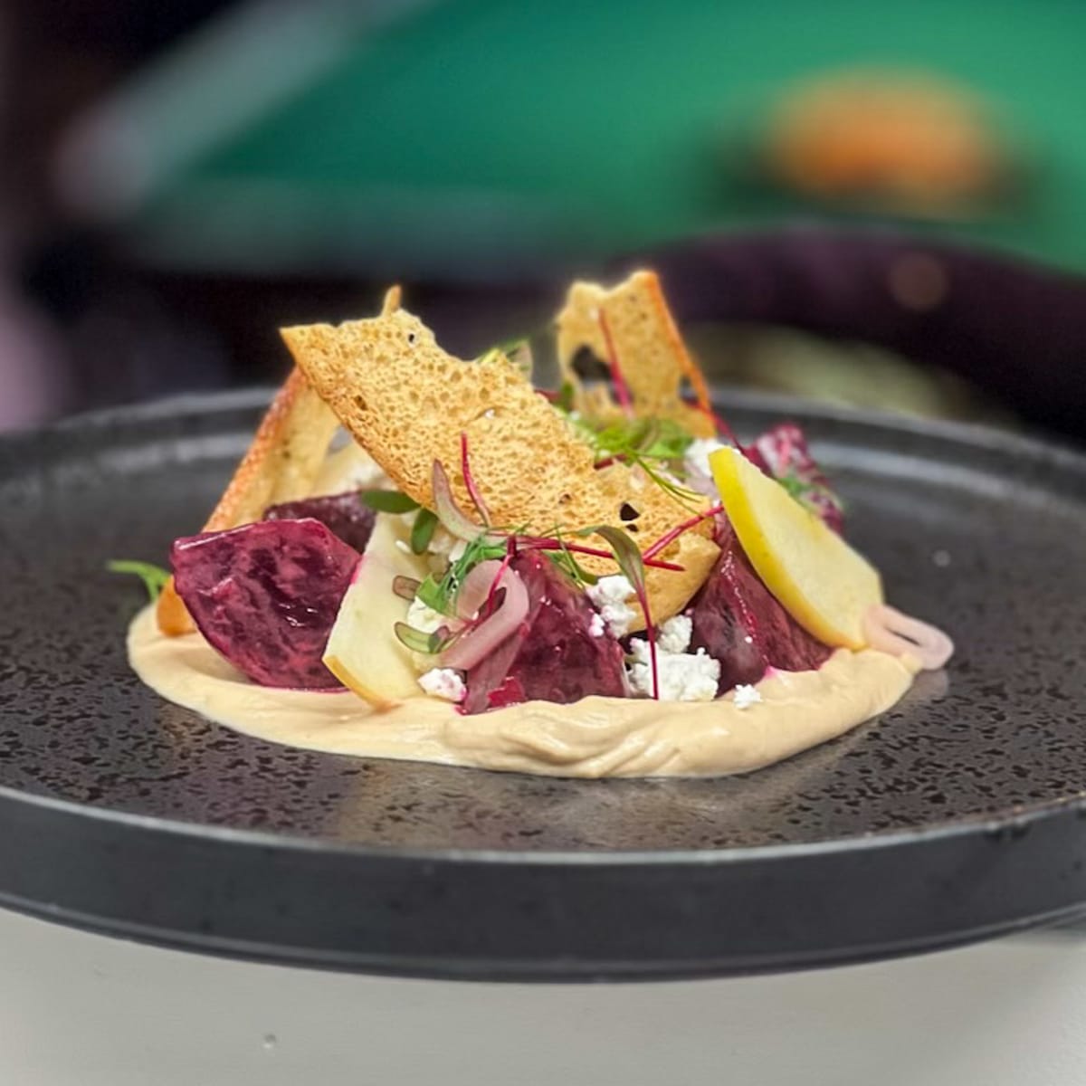 beet-and-apple-salad,-cashew-butter,-thin-croutons,-pickled-shallots-and-goat-cheese-crumble