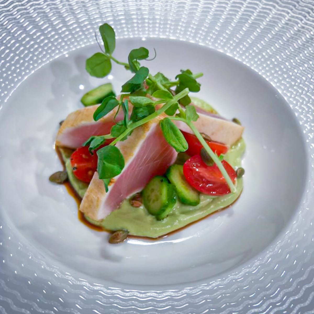 tuna-tataki-served-with-avocado-crema,-fresh-cucumber,-and-grape-tomatoes