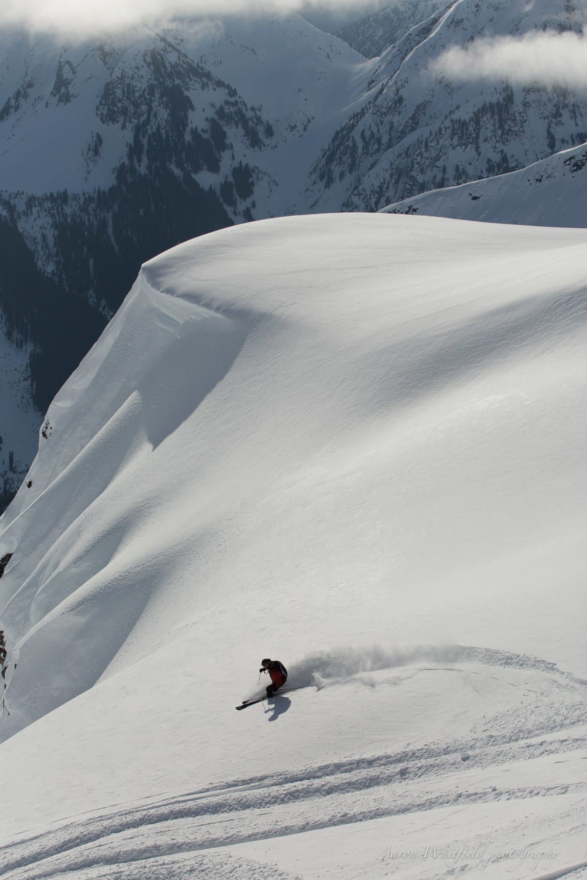 Skier_Turning_on_Slope_Snow_Spray_Distant_1