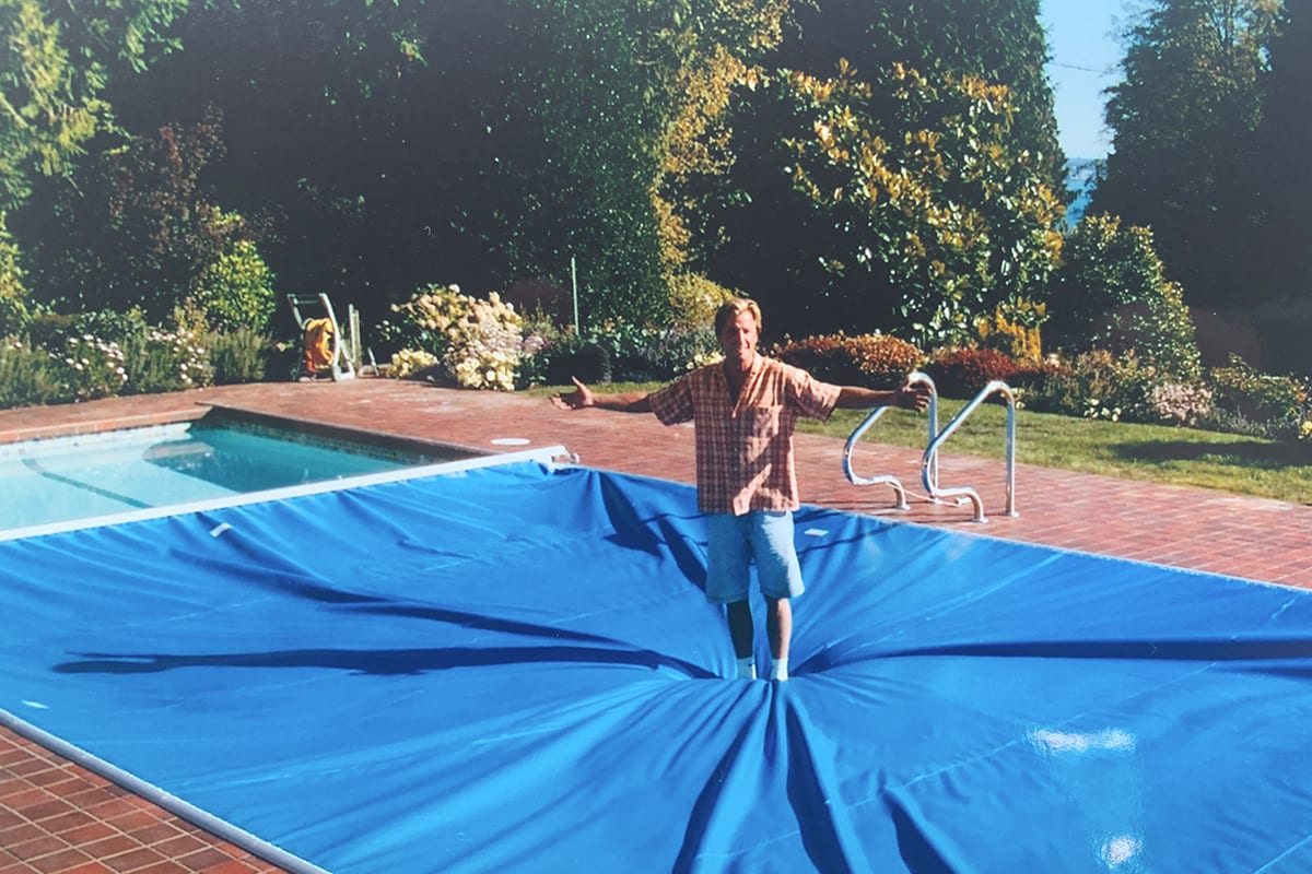 Our founder Allan Horwood demonstrates the strength of an automatic pool cover. Pools and beaches have been an important part of Allan’s life for as long as he can remember.