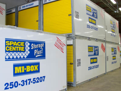 Multiple MI-BOX Storage Containers Stacked in Warehouse