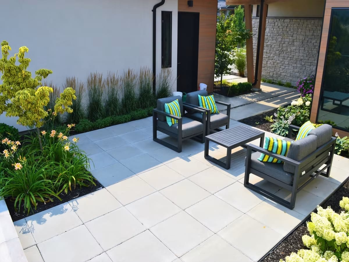 A stunning patio with patio stone pavers by Synergy Landscape Kelowna