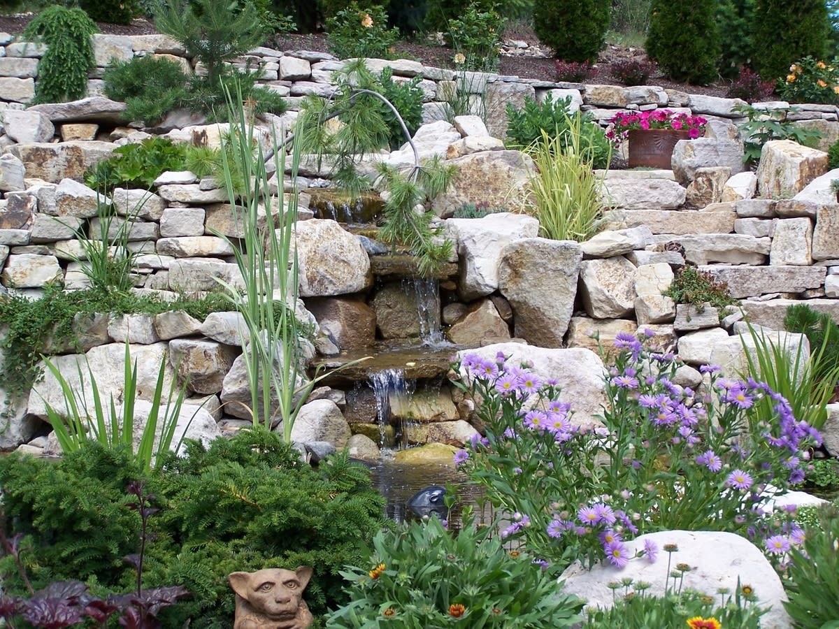 The soothing sound of cascading water meets rugged natural texture in this close-up of a Synergy Landscape Design project, where every detail supports balance, beauty, and expert Kelowna landscape design.