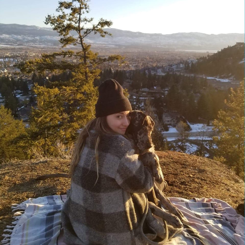 Relaxing in her backyard on Knox Mountain, Kelowna, BC.